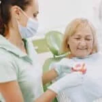 Topeka Oral Surgery: Dental Implants vs Dentures - Choosing the Best Option